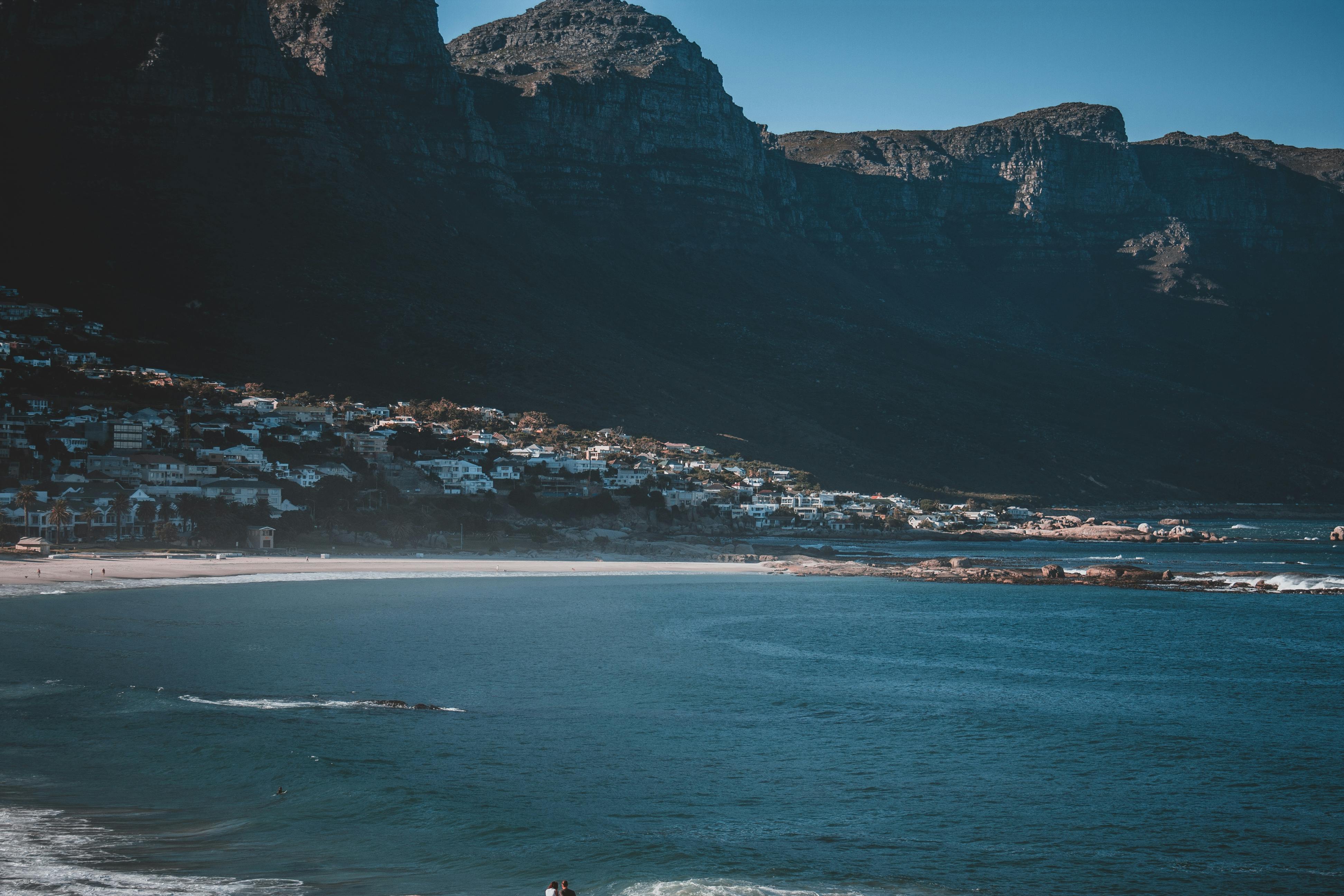 White sand of Camps Bay Beach beneath the Twelve Apostles mountain range